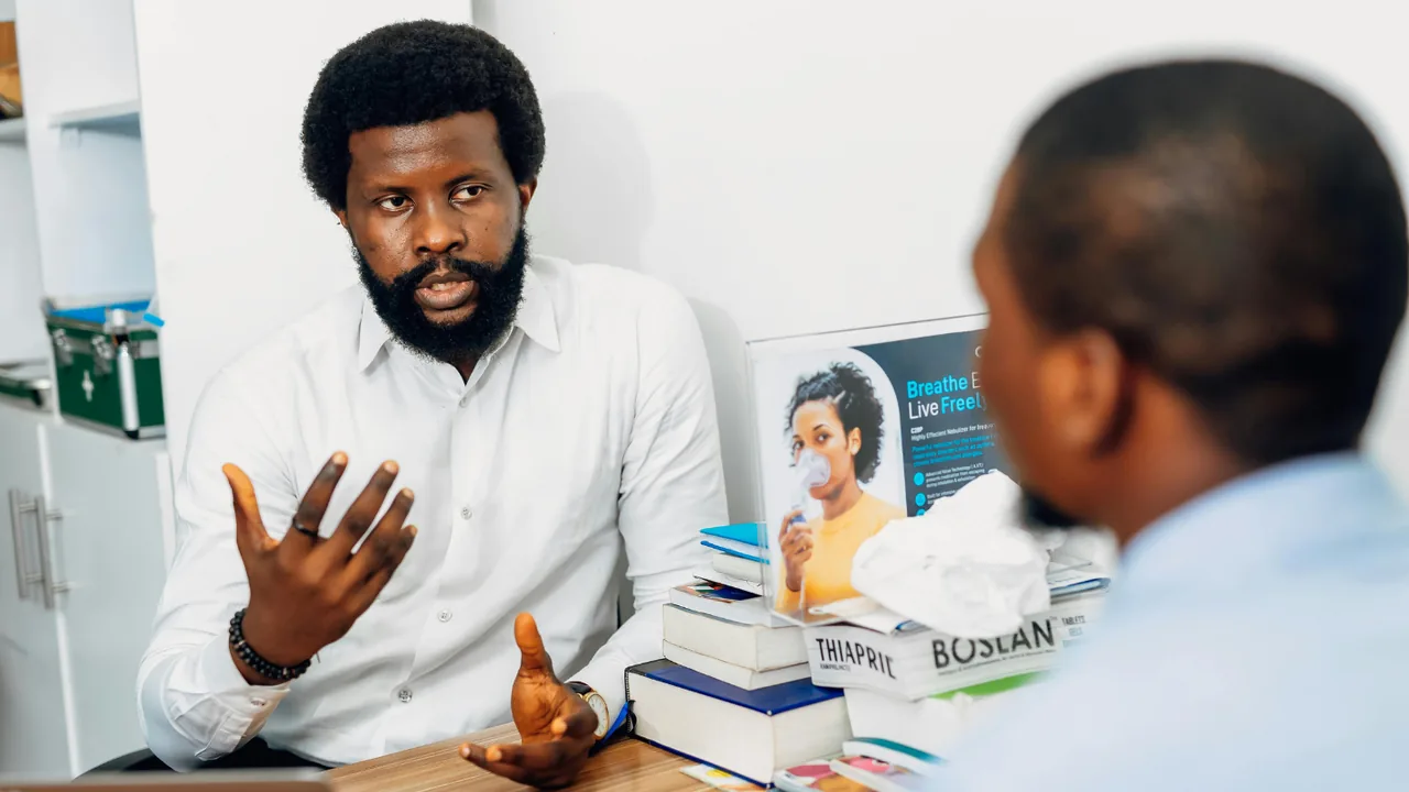 A Urithi Consultancy adviser in discussion with a client