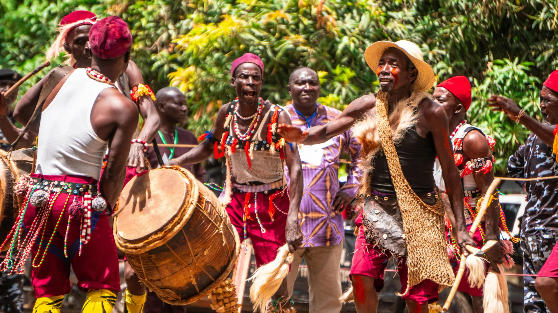 Tanzanian dancers and drummers performing in traditional dress